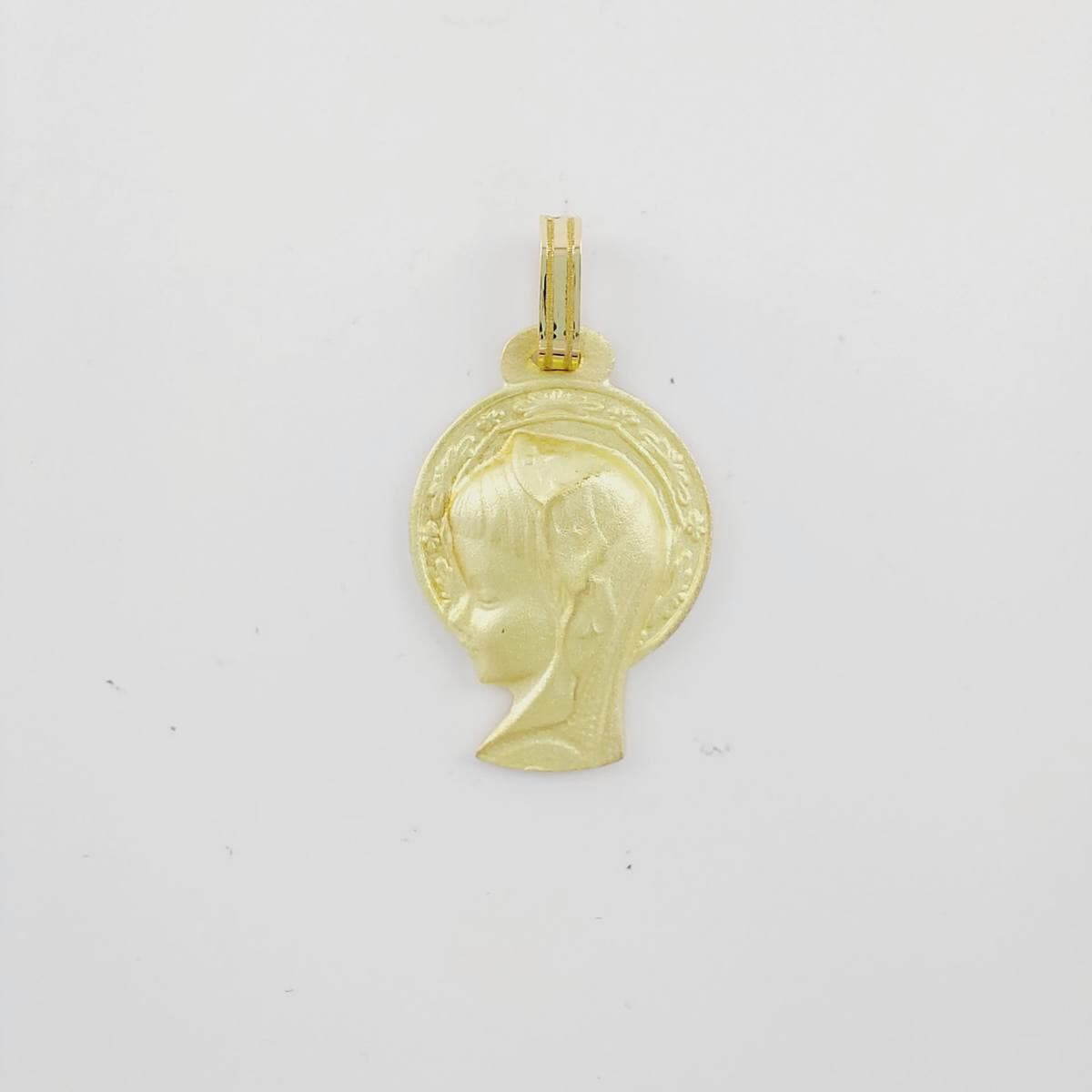 Medalla virgen niña silueta